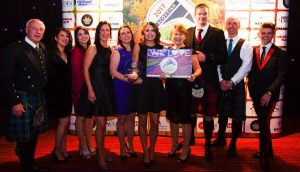 The X Factor's James Hughes (far right) joins the Wood Leisure team under the spotlight at the awards