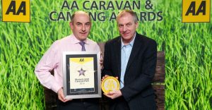 Henry Wild (left) is presented with his park's award by David Hancock, AA Caravan and Camping Coordinator