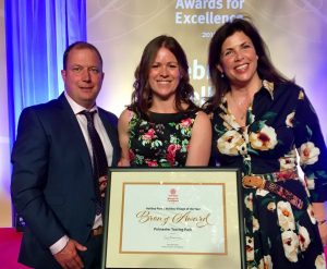 TV presenter Kirstie Allsopp (right) congratulates Phil and Becki Osborne on their VisitEngland 2018 award