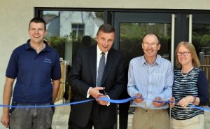 It's a snip: David Jones MP cuts the ribbon to officially open The Mill, the holiday park's new country club, accompanied by (left) Stephen Feely who is park warden and the son-in-law of park owners (right) Arthur and Pamela Jones