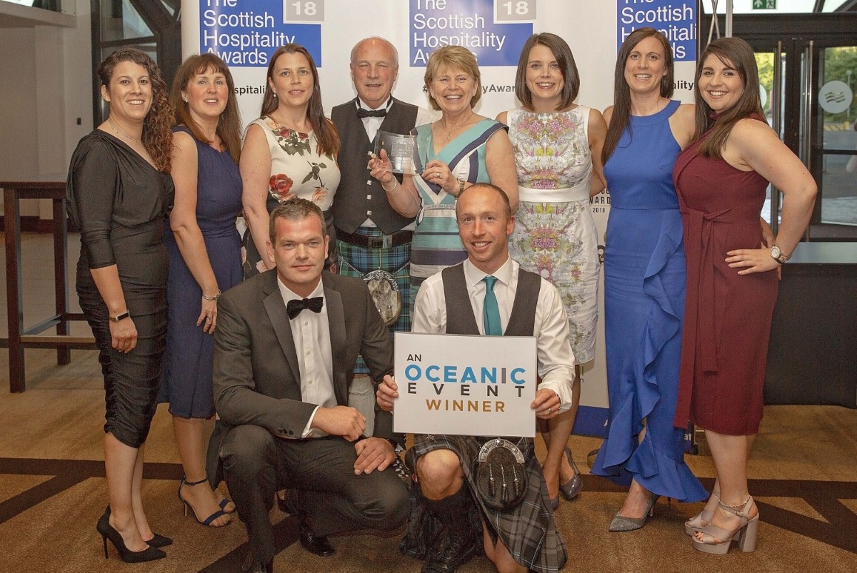 Colin and Margaret Wood (rear, centre) with other family members and senior staff at the awards ceremony