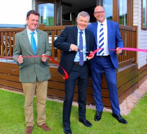 Its a snip Willie Rennie MSP declares open the new Elie holiday home development with Alex Nairn of Elie Estate and Kevan Lodge director of Abbeyford Leisure