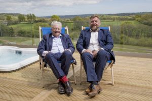 Peerless views: Lord Dafydd Elis-Thomas (left) joins Huw Pendleton outside one of the park's hot-tub lodges