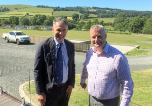 Chris Davies MP (right) explores the scenic grounds of Rockbridge park in Powys with business co-owner Glenn Jones