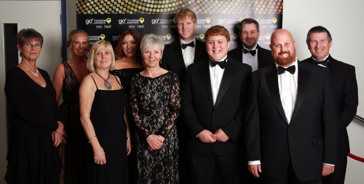 Winning side: the proud team members of Craiglwyd Hall Caravan Park are congratulated by award judges