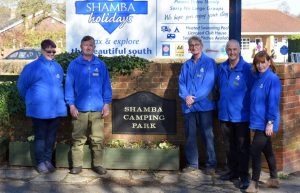 Tracey Daffern (left) and her husband Paul (centre) with the park team at Shamba Holidays in the New Forest