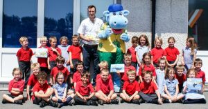 Pupils at St Newlyn East Primary School, near Newquay are joined by Hendra Jon Hyatt and park mascot Henry Hippo