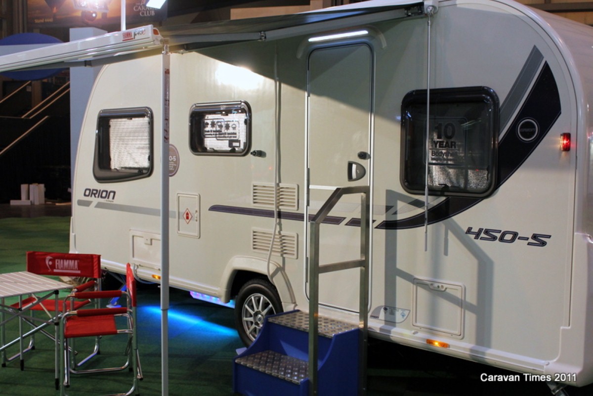 The Bailey Orion 450/5 features rear triple bunks and an L-shaped lounge