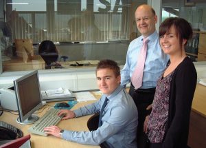 Salop Leisure financial director Stephen Higgins with apprentices Natalie Watkins and Jack Clarke