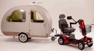 The QTvan measures a tiny 2m x 75cm and has a top speed of 5mph when matched with a mobility scooter