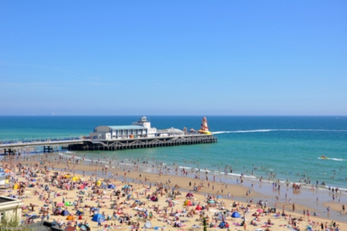 Sun lovers flock to the beach to enjoy the hot weather