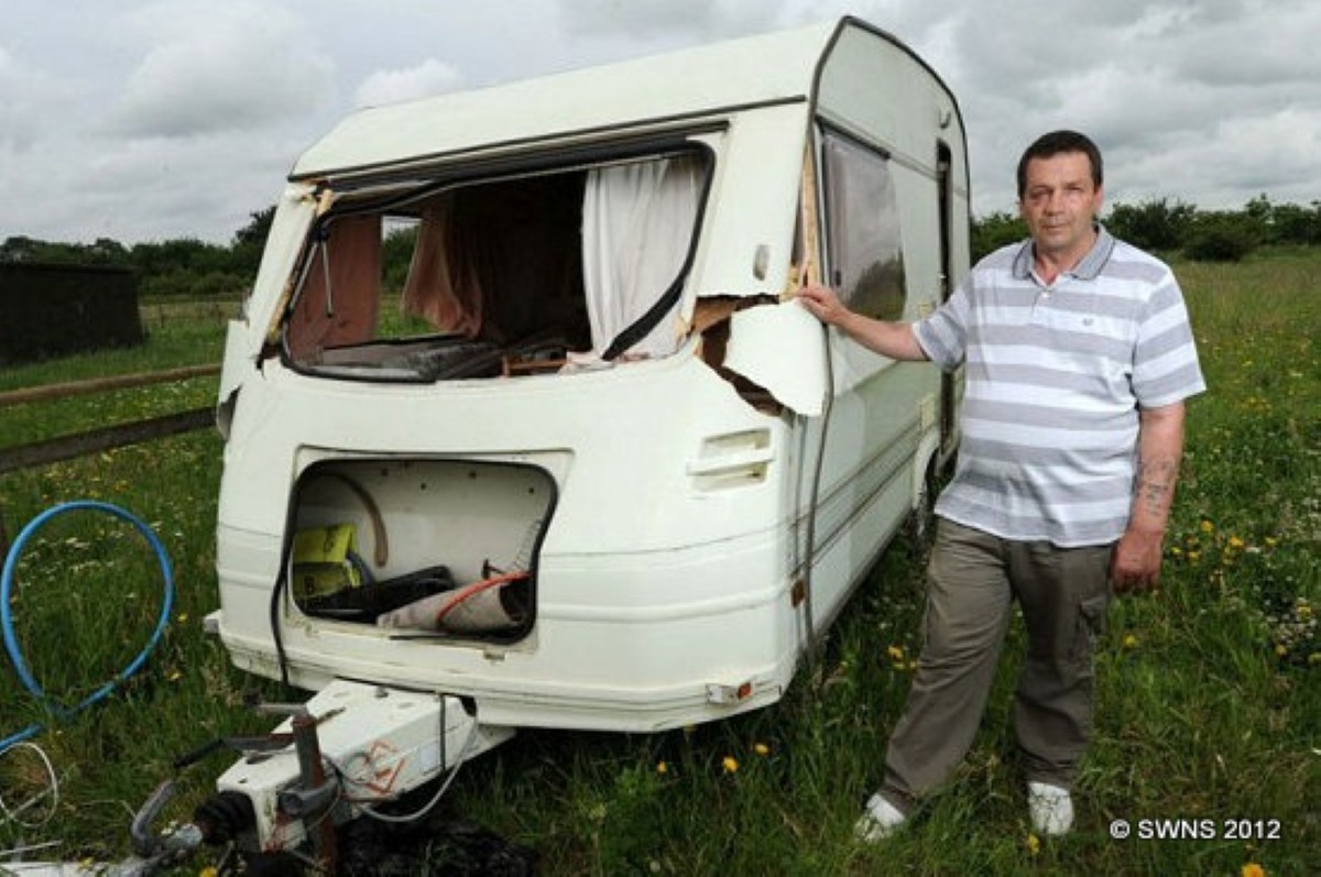 David Sinclair with his storm-ravaged caravan