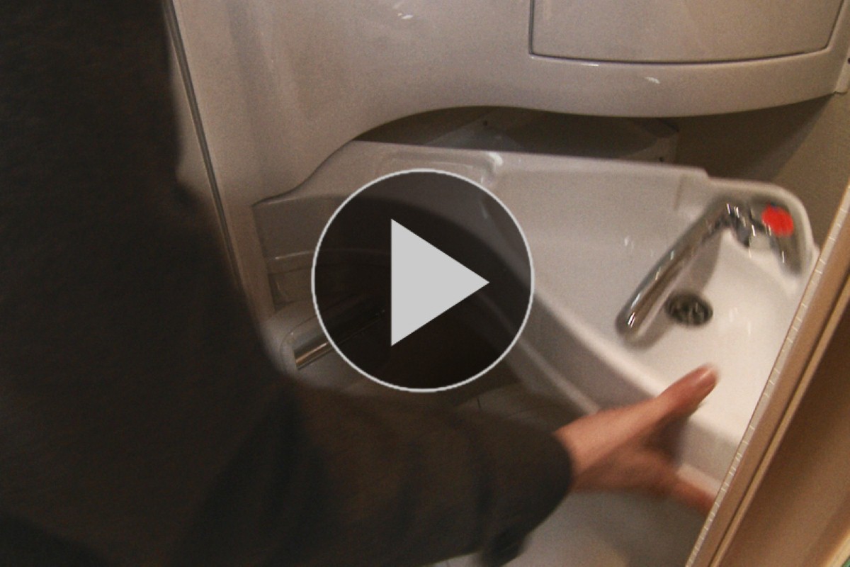 The bathroom in the Elddis Autoquest features a clever fold-out sink