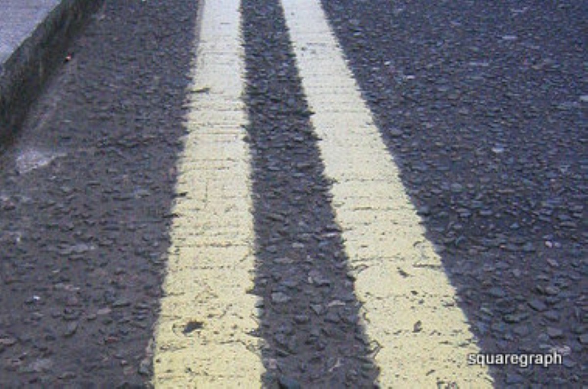 The tourer is parked on yellow lines - but cannot be moved