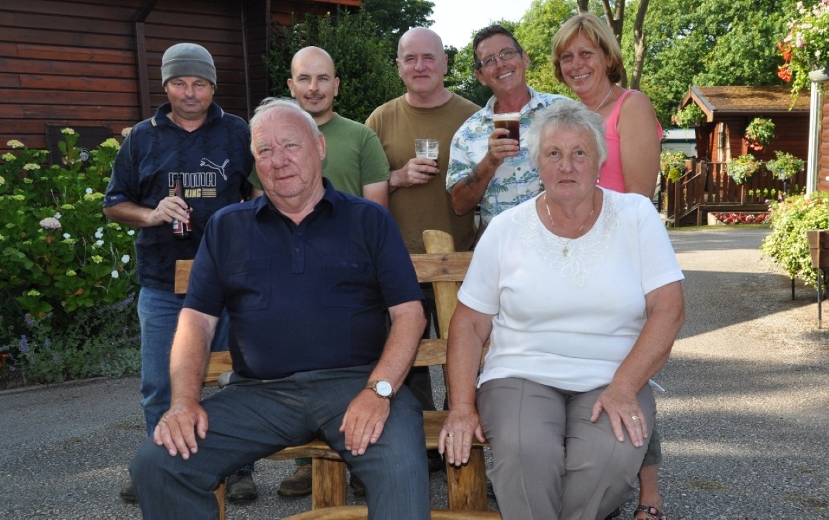Dave and Christine Ball (front row) can now enjoy their retirement after two decades at Tree Tops Caravan Park