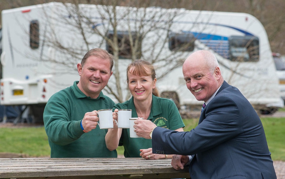 Jamie and Lynette Cook with NatWest's Kevin Gidley (right) at Waterrow Touring Park