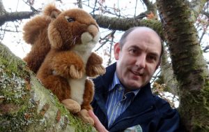 Henry Wild plants one of the cute squirrels in a tree