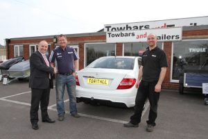 The NTTA congratulating competition winner Richard Hickton at Towbar and Trailers in Chesterfield