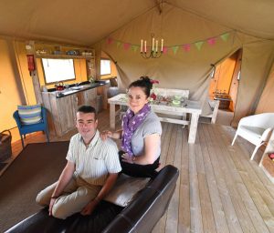 Owners, Grant and Gillian Turnbull inside one of their new Safari tents