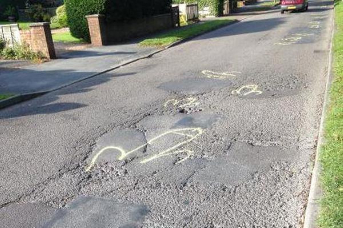One local has taken it upon themselves to highlight Surrye's pothole problem with phallic imagery