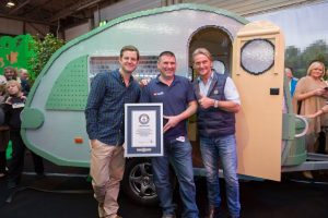 Matt Baker, Duncan Titmarsh and Carl Fogarty standing proud outside the LEGO caravan