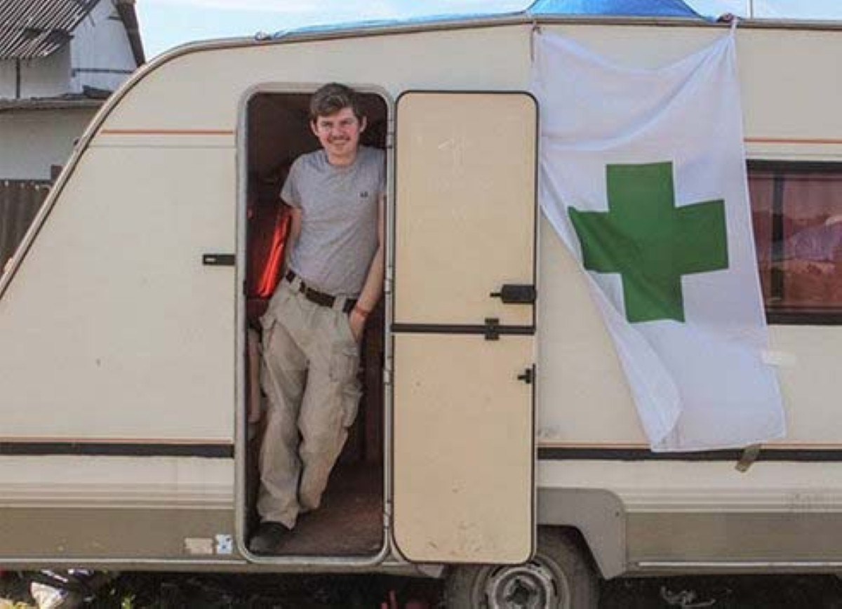 A Caravan for Calais charity worker with one of the caravans used for medical emergencies
