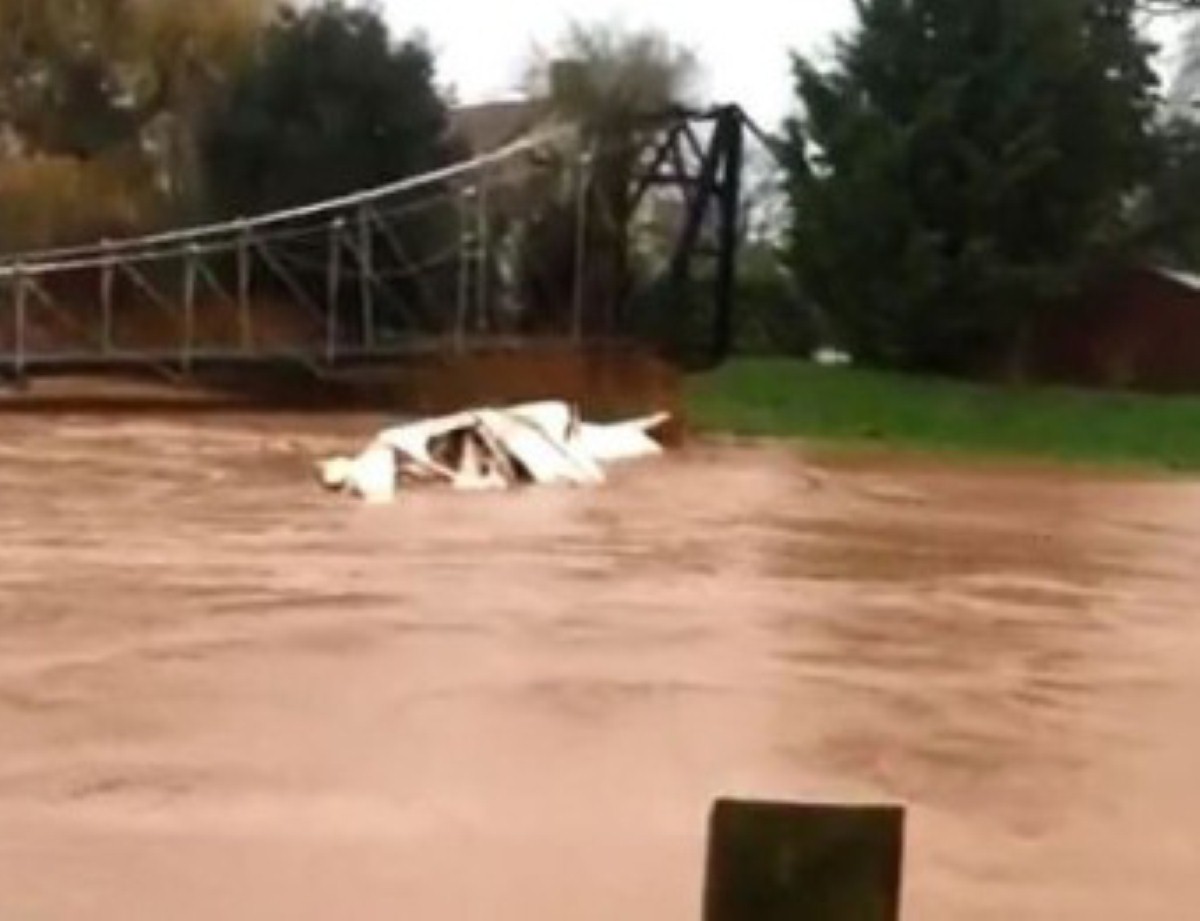 Watch on as this caravan is swept away down River Tone