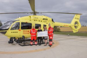Caravan Guard presenting the cheque to Yorkshire Air Ambulance