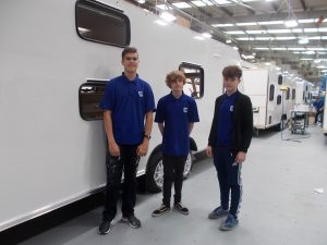 The three apprentices looking thrilled