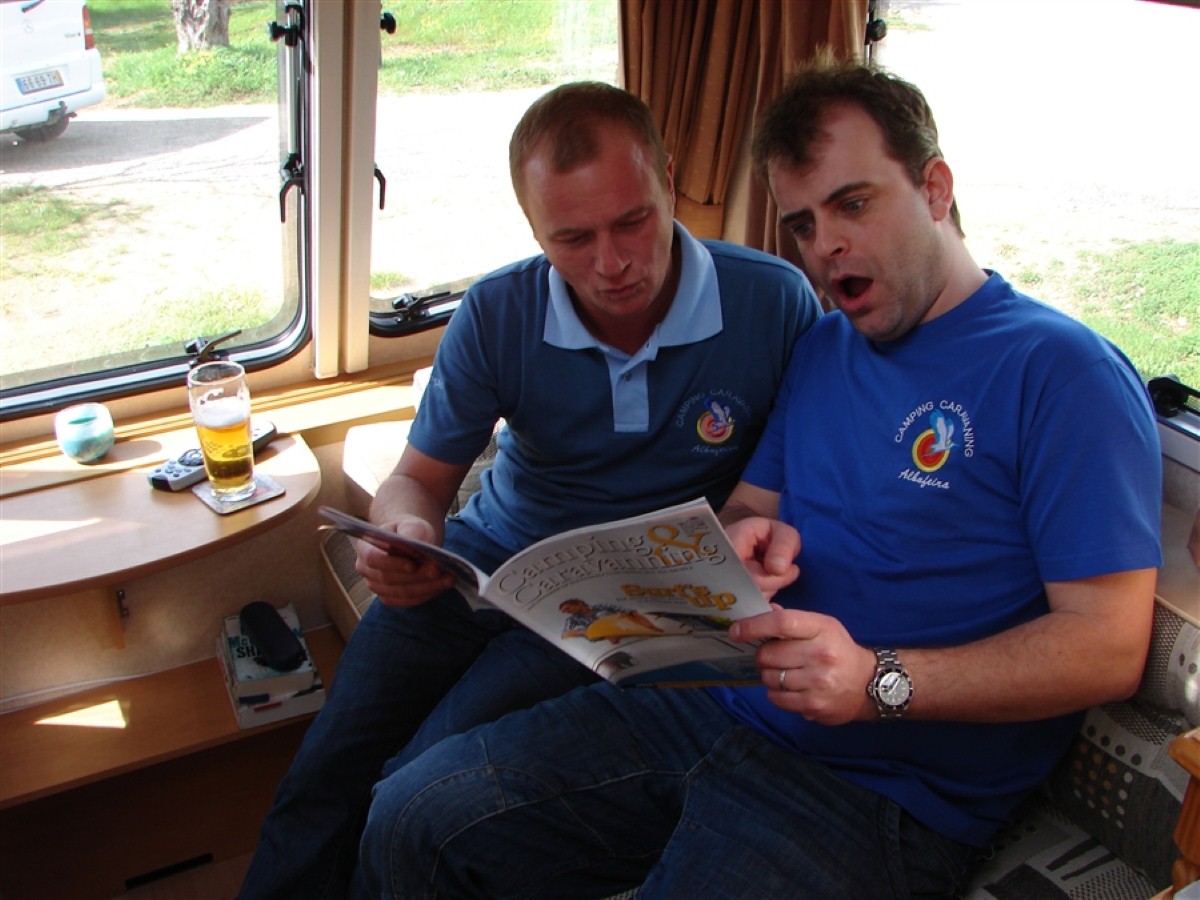Corrie stars Steve Arnold and Simon Gregson relax inside a caravan