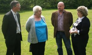 Cllrs James Lewis, Mark Dobson and Andrea McKenna and resident Anne Murphy discuss the application