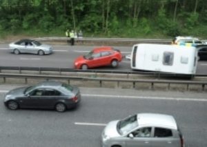 Shocked motorists saw the tourer and towcar roll over several times on the M4 westbound
