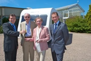 Margaret & Leo Beckett collect the keys from Sales Manager Mark Clayton and Bailey Managing Director Nick Howard