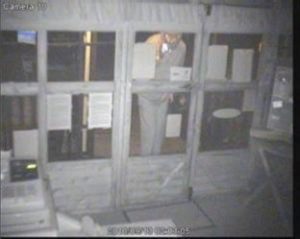 Footage from Old Down Touring Park CCTV shows a masked man peering through a shop window at the site