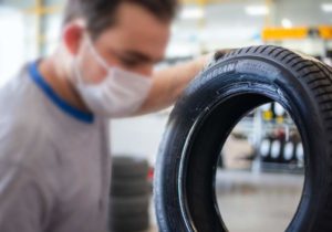 Man inspecting a tyre