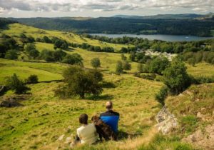 Couple with a dog enjoying the countryside