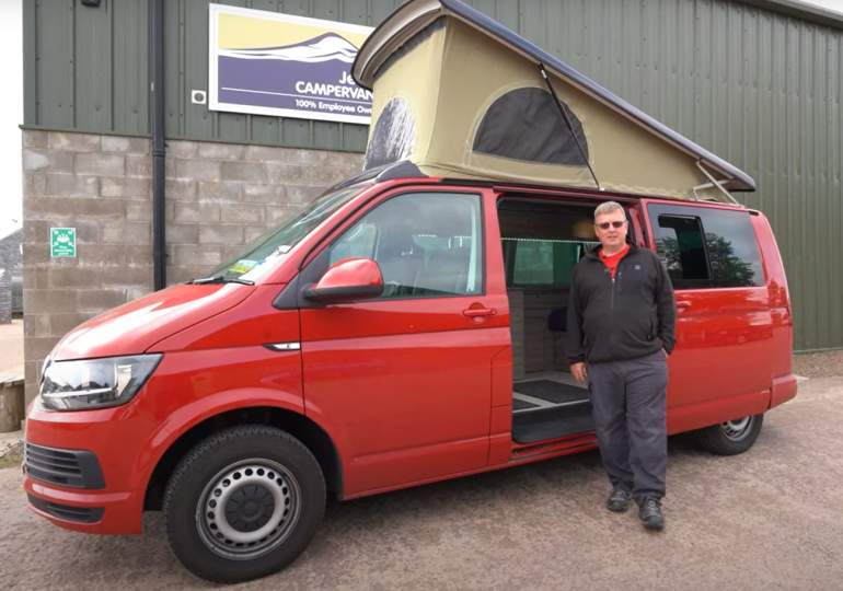 Domnhall Dodds standing with his Jerba Campervan