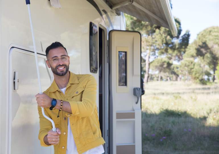 Man adjusting his awning