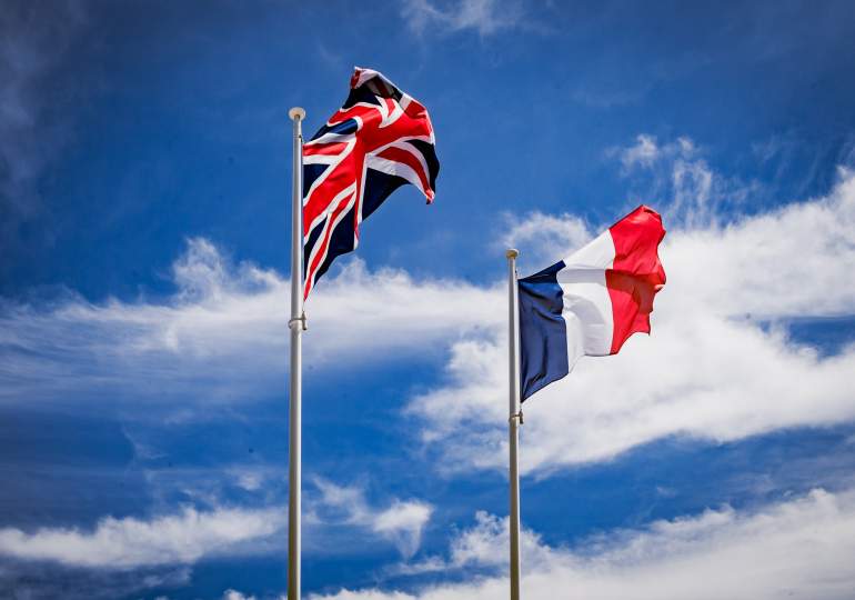 Union flag and French tricolour in the breeze