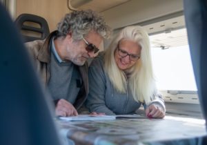 A couple reading a book in a motorhome