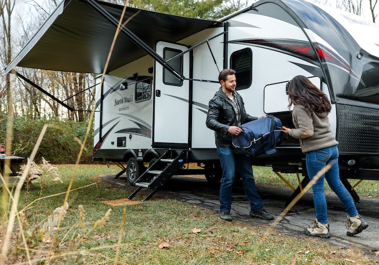 Couple outside a leisure vehicle