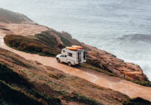 Motorhome travelling along a road by the sea