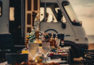 Wine glasses and a Christmas tree with a motorhome in the background