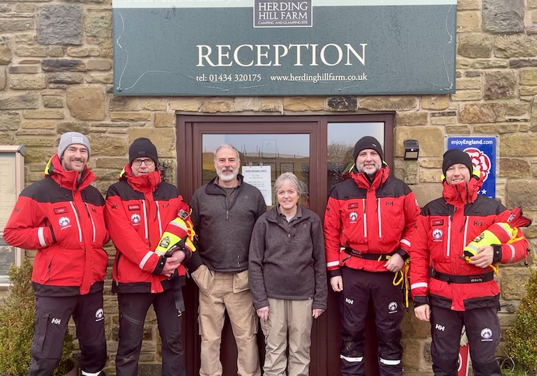 Members of the mountain rescue team posing with the site managers
