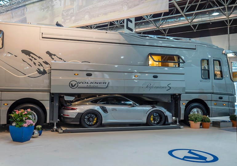 A vast motorhome with a garage for a car