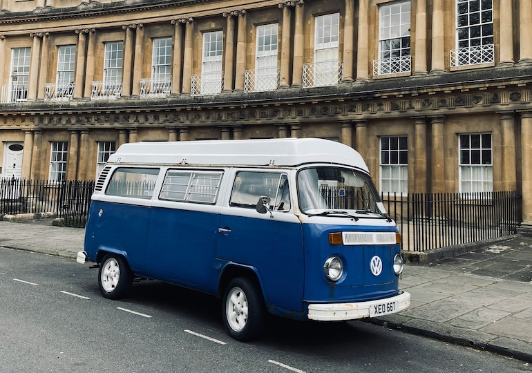 A campervan parked up outside a house