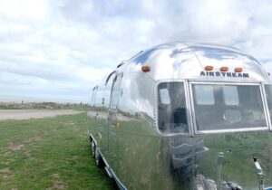 An Airstream parked in a field