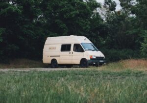 A converted van parked up by the side of the road