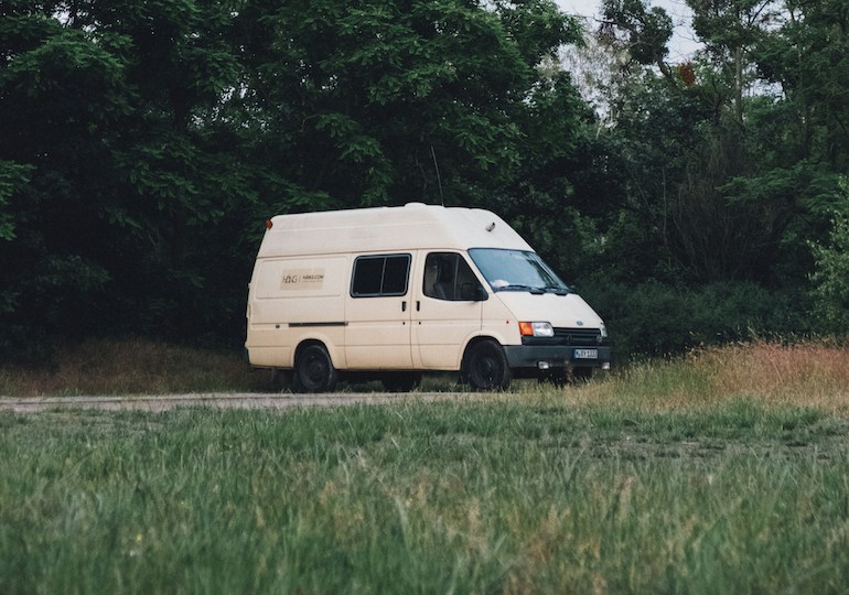 A converted van parked up by the side of the road