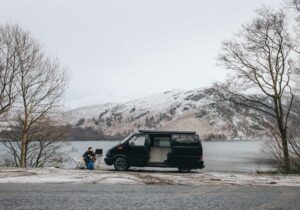 A campervan parked up in a wintry setting